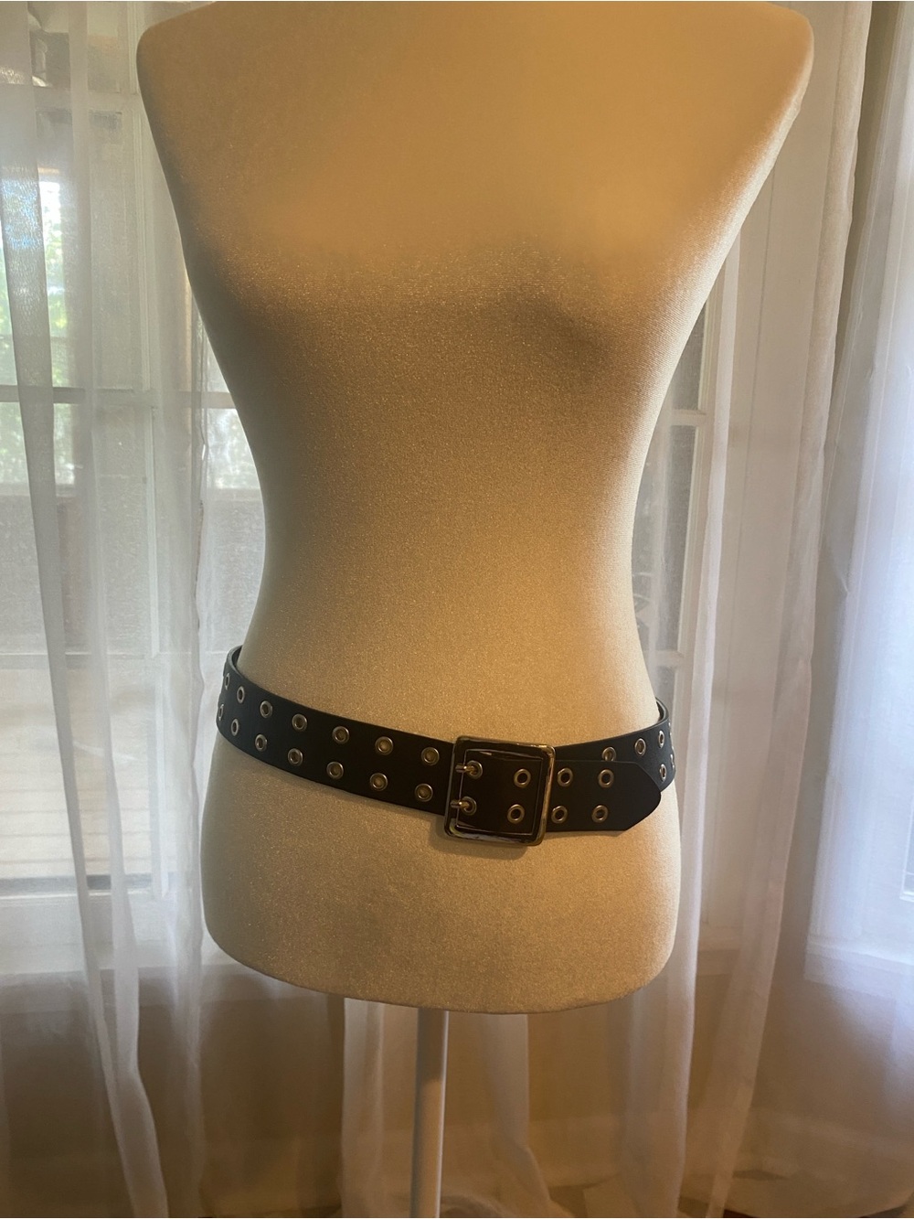 Black leather belt with silver hardware